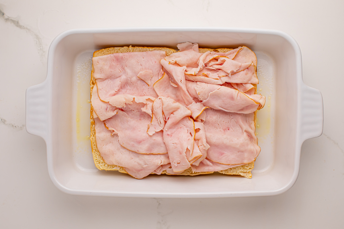 Add deli chicken slices to top of bread