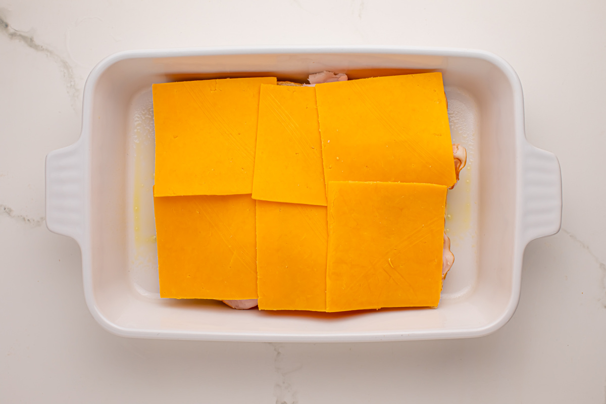 Cheese slices added to chicken slices