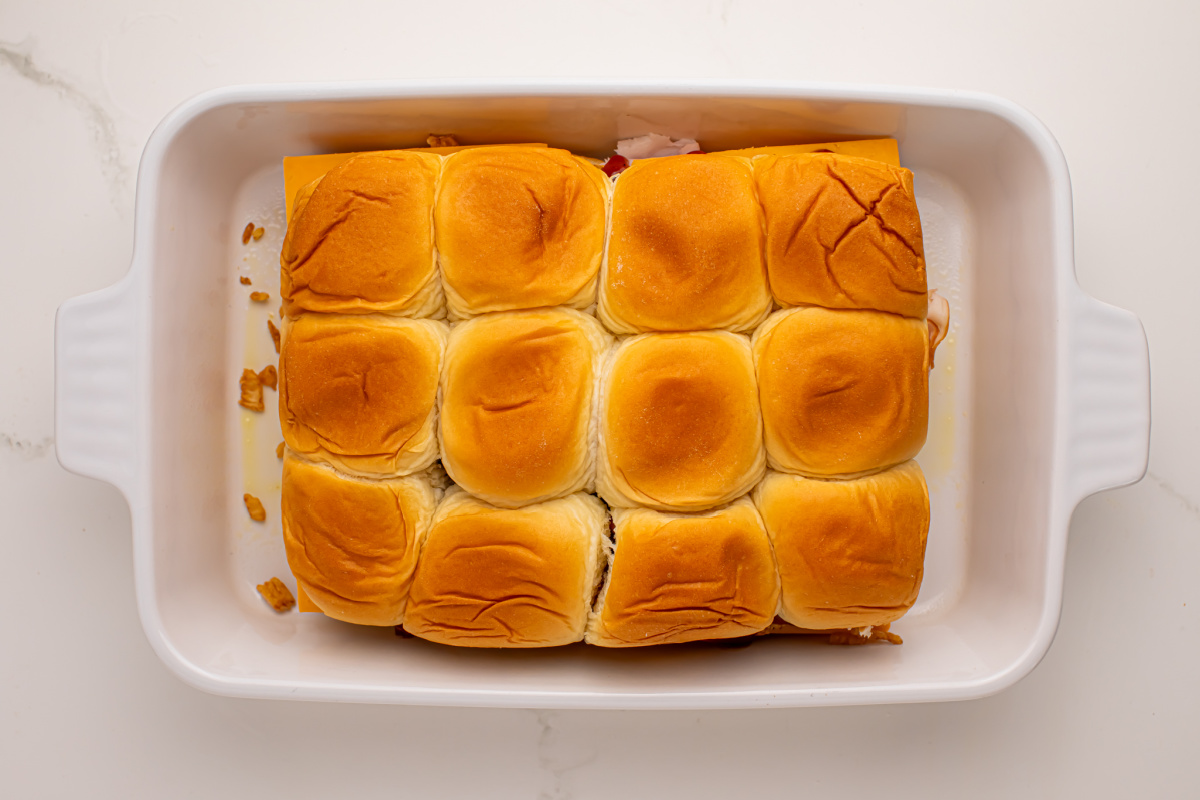 Add the top half of the bread to the top