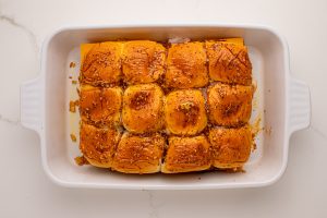 butter seasoning brushed on top of sliders