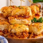 BBQ Deli Chicken Sliders stacked on a plate