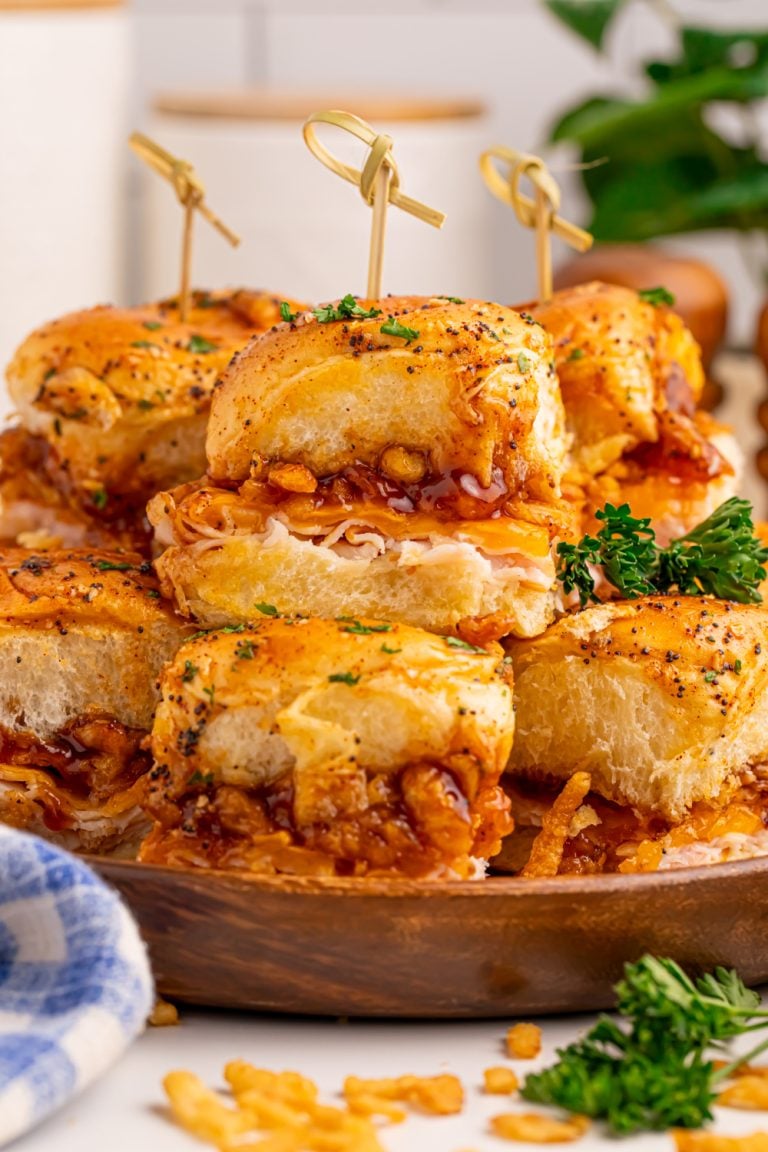 BBQ Deli Chicken Sliders stacked on a plate