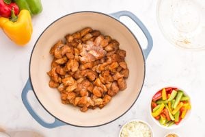 seasoned chicken added to dutch oven