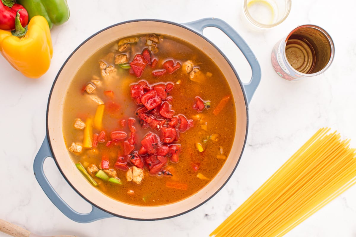 Add chicken stock and fire-roasted tomatoes to the pot