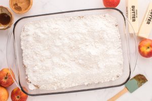 cake mix sprinkled on top of apples