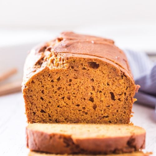 Classic Pumpkin Bread sliced on a cutting board