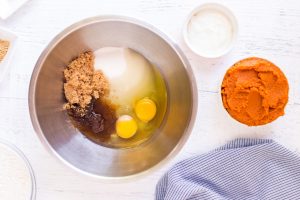 eggs, both sugars (brown and granulated), and vanilla extract in a mixing bowl