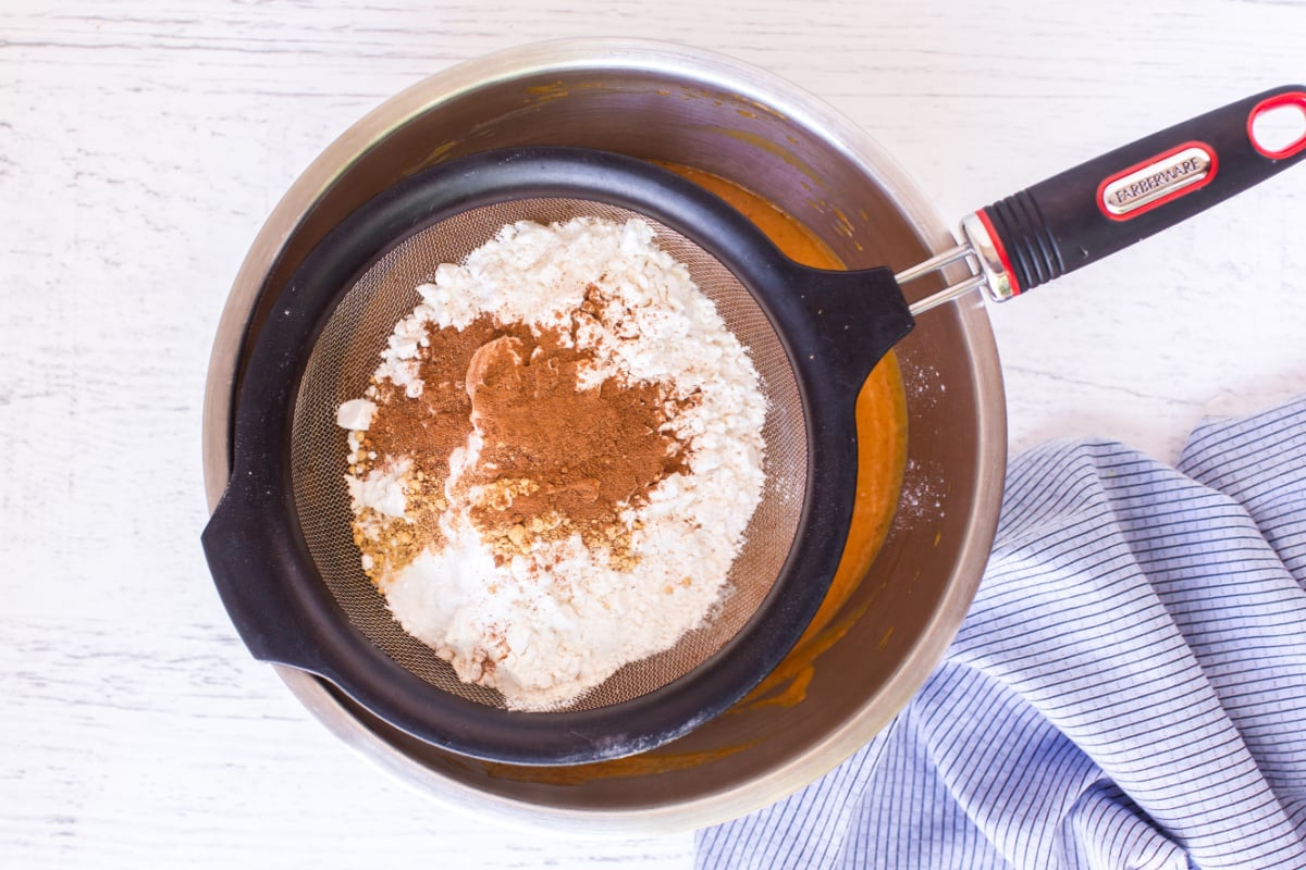 Sift in flour, baking soda, cinnamon, ginger, nutmeg and salt