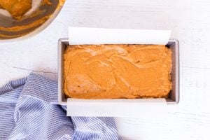 bread dough added to baking pan