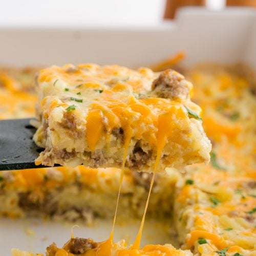 Scoop hash brown breakfast casserole with spatula