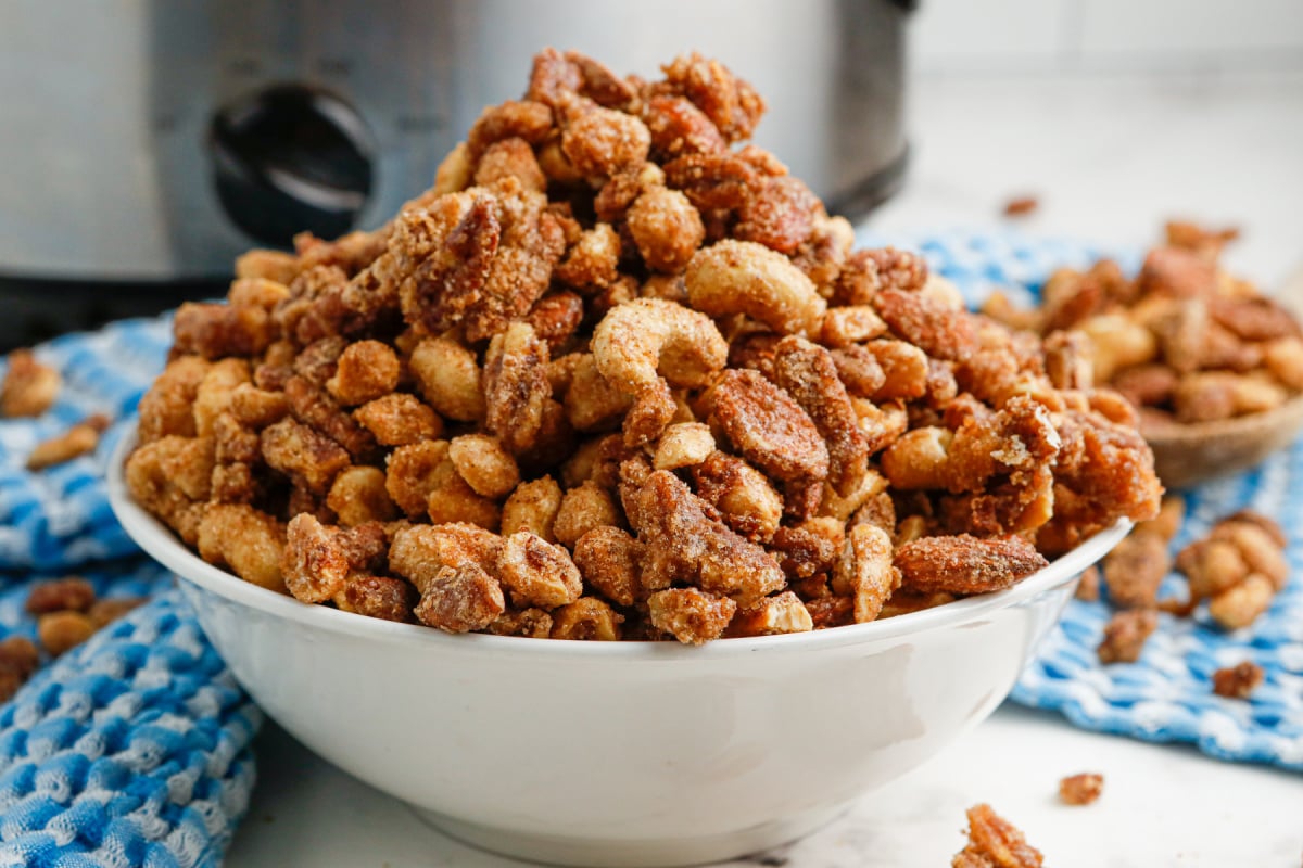 slow cooker candied mixed nuts in a bowl