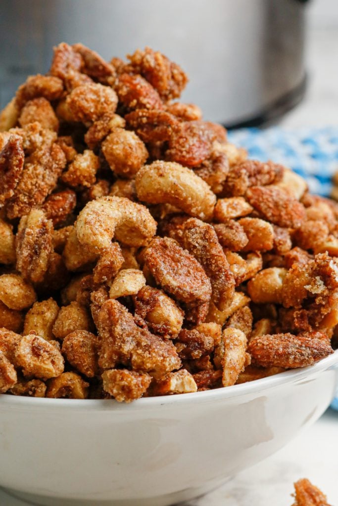 slow cooker candied mixed nuts in a bowl
