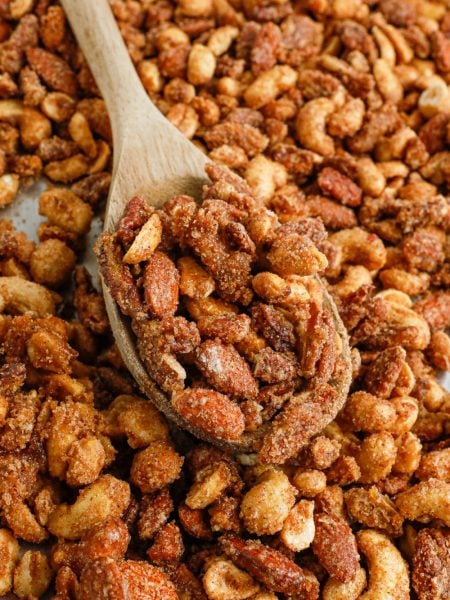 slow cooker candied mixed nuts on a baking sheet