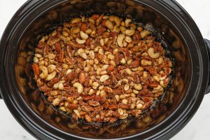 slow cooker candied mixed nuts in a slow cooker