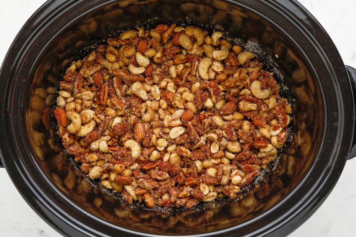 slow cooker candied mixed nuts in a slow cooker