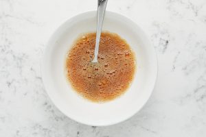 vanilla and egg whites mixed in a bowl