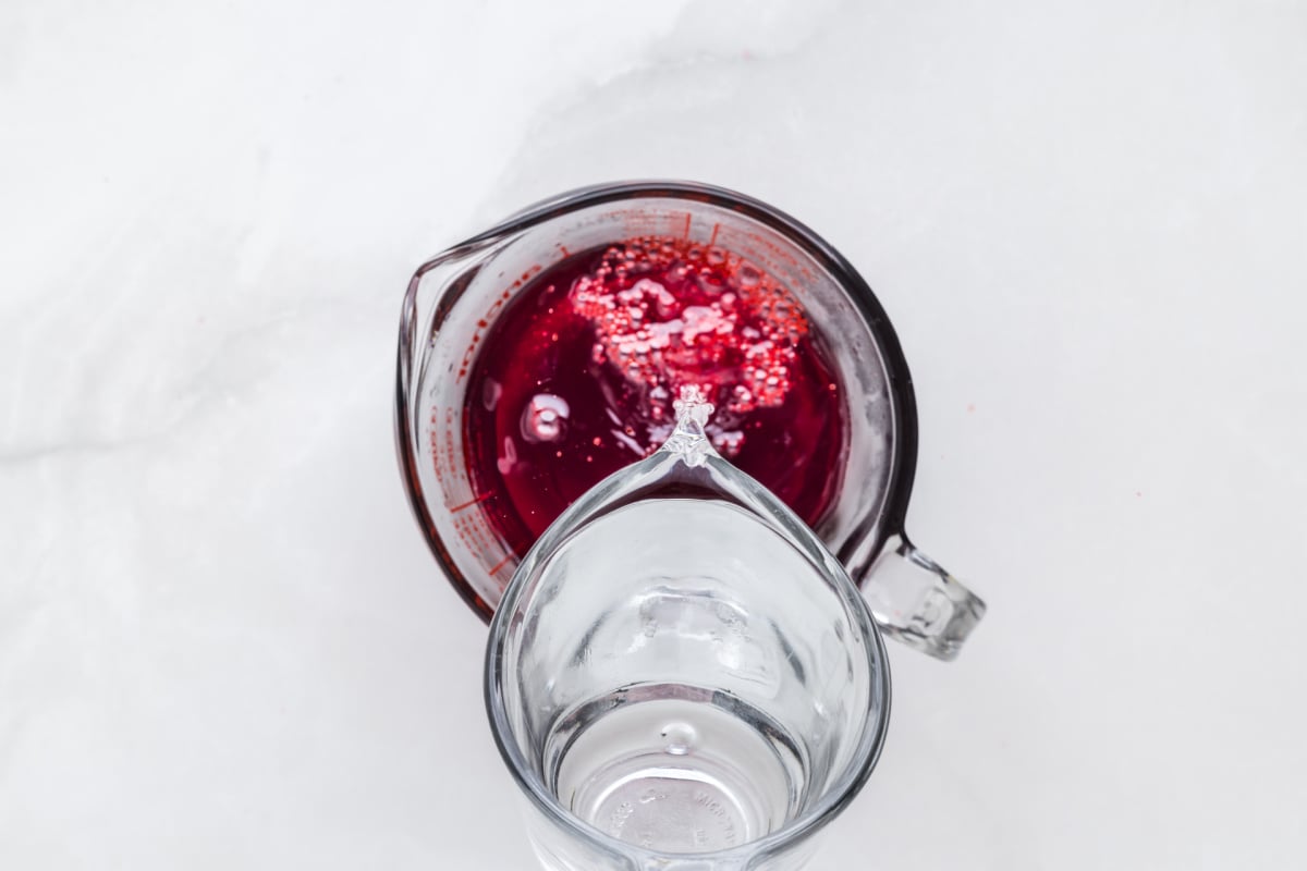 pouring warm water into jello mix