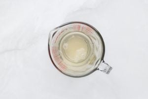 water mixed with gelatin in measuring cup