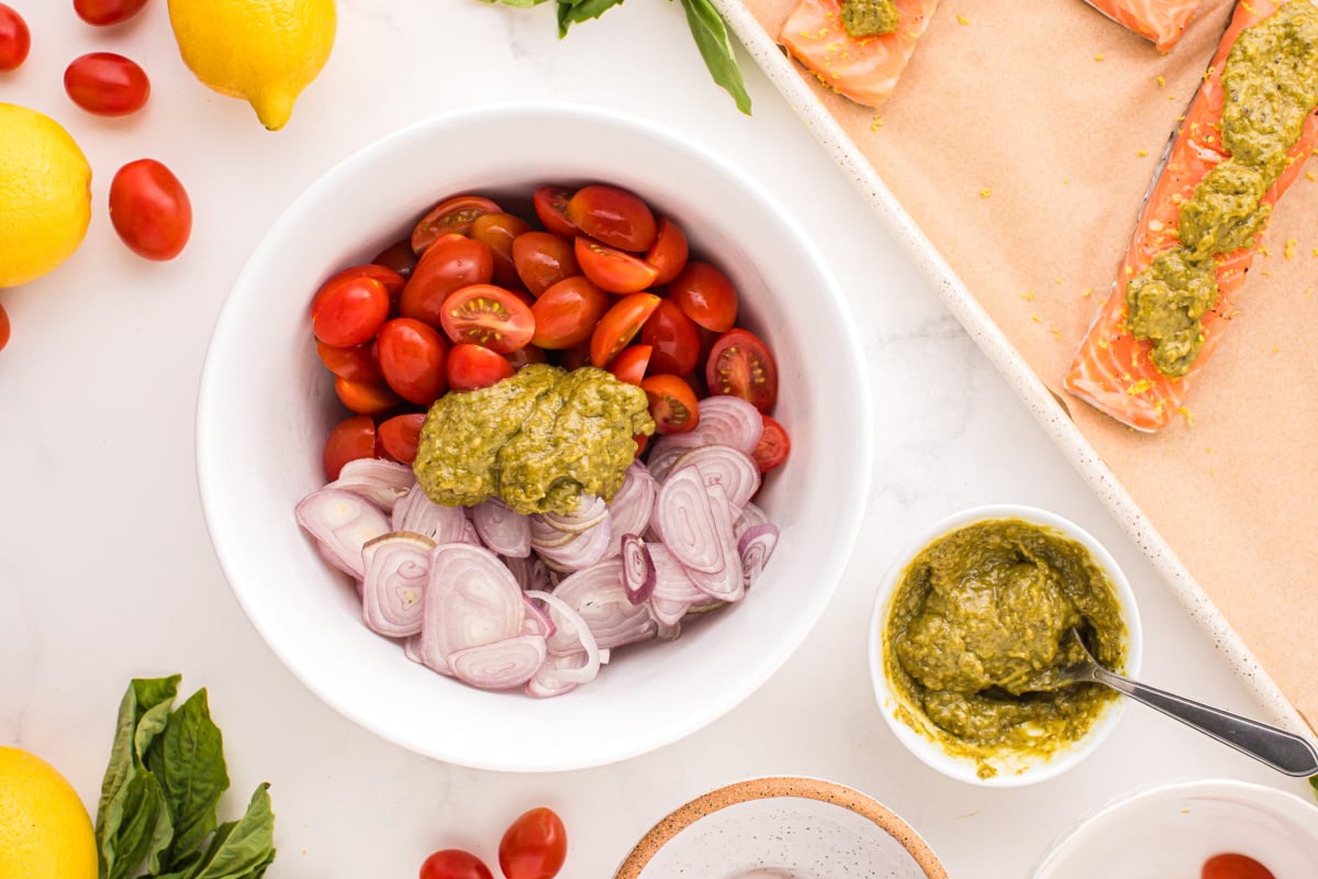 Add tomatoes, shallot slices and pesto to bowl