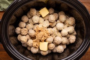 butter, brown sugar, and Italian dressing mix added to slow cooker