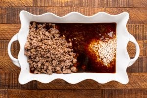 rice, cooked beef, consomme and seasonings added to baking dish