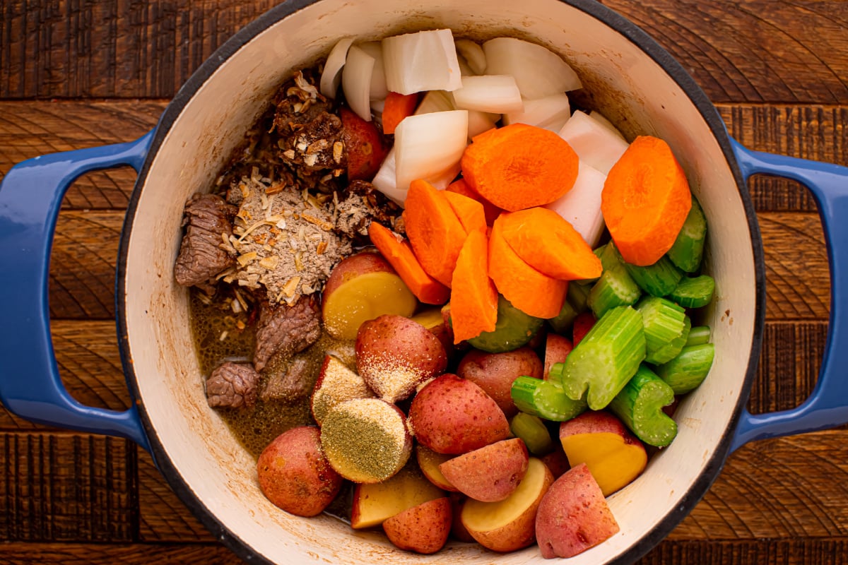 Add onions, carrots, celery, potatoes and seasonings to Dutch oven