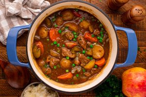 apple cider beef stew in a soup pot