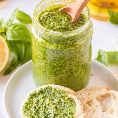 Place homemade pesto in a jar and spread on a piece of bread
