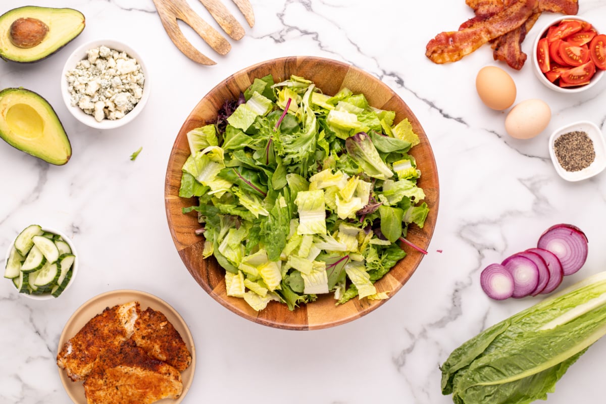 Chop lettuce and put into bowl