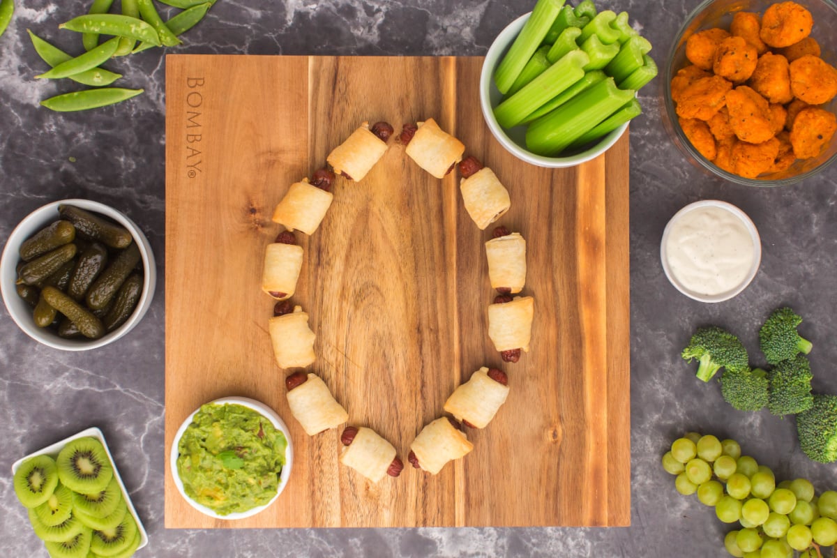 Pig wrapped in blanket forming silhouette of football