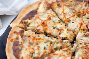 Thai Chicken Pizza cut into slices
