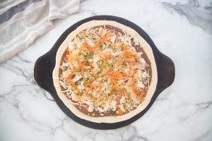 toppings added to pizza