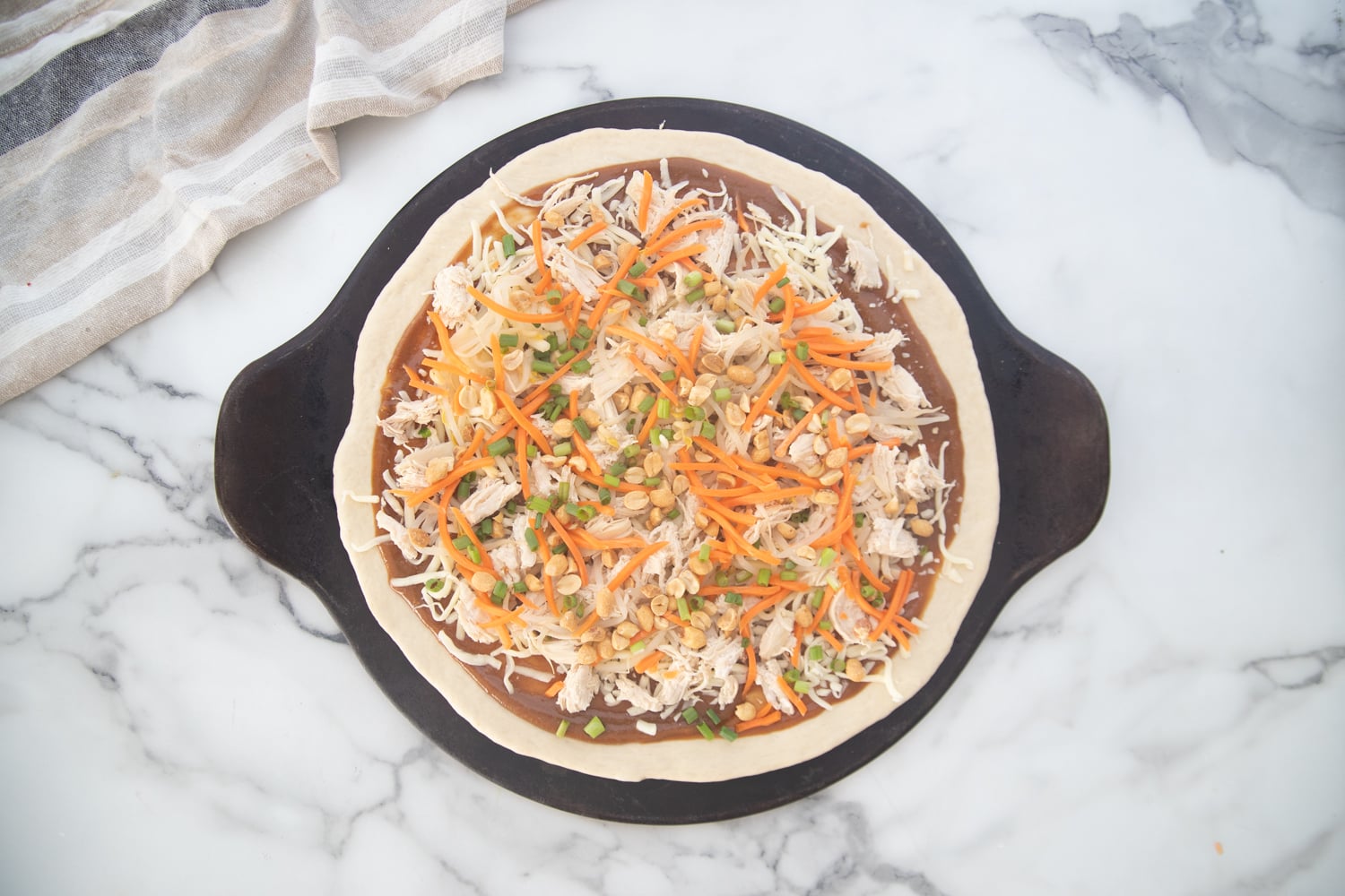 Toppings added to pizza