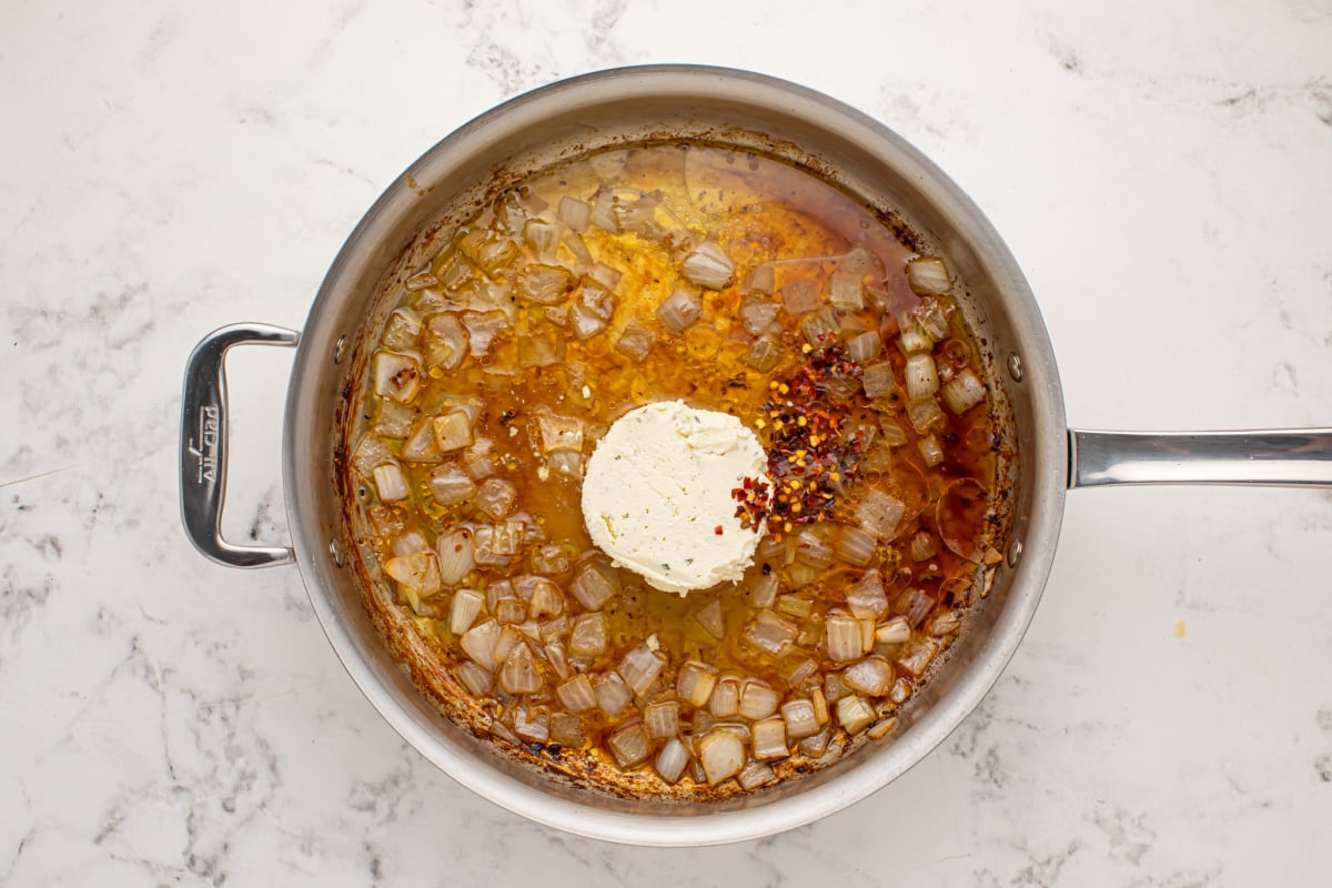 Add boursin cheese and chili flakes to pan