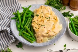 Creamy Boursin Chicken Skillet on a plate with green beans