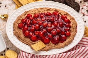 cherry chocolate cheesecake dip on a plater