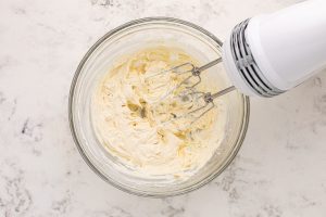 cream cheese and vanilla mixed in a bowl