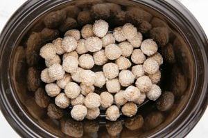 meatballs placed in a slow cooker
