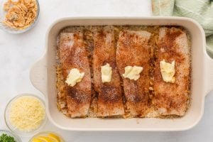 butter added to top of fish