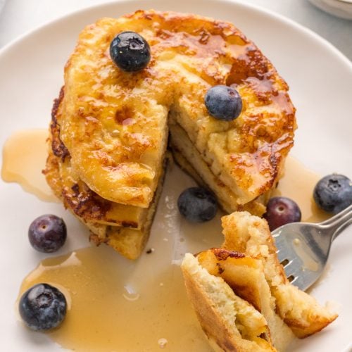 English Muffin French Toast on a plate with blueberries