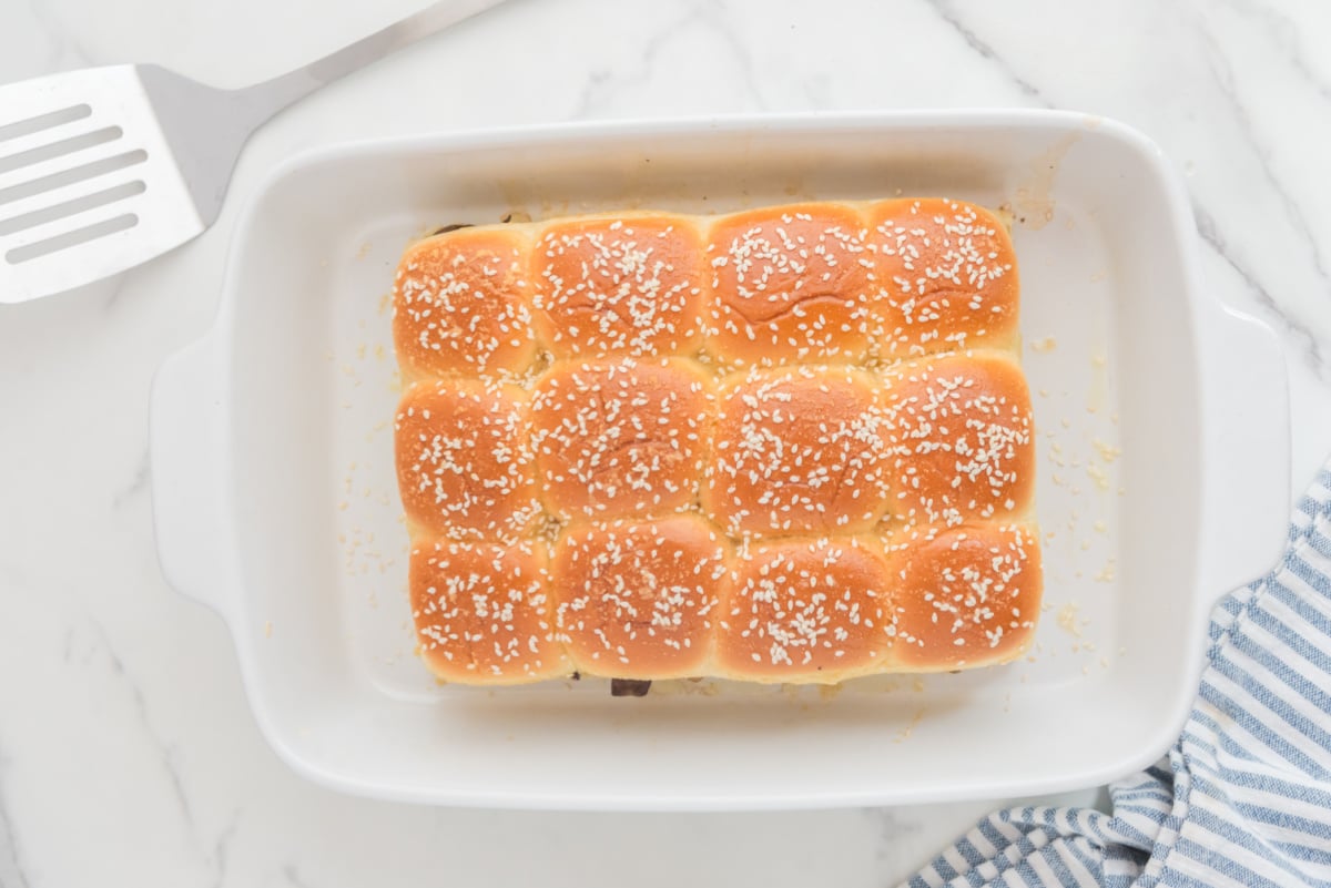 Sprinkle sesame seeds on top of steamed buns