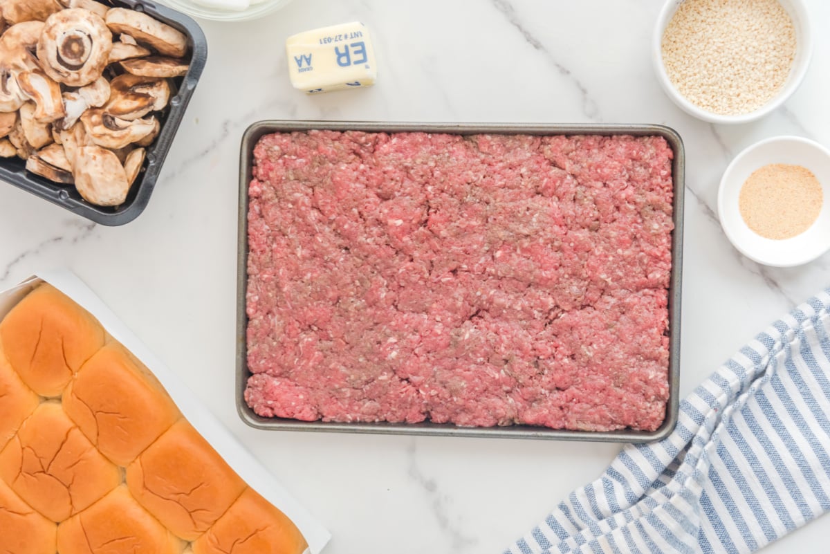 Beef mixture pressed into baking pan