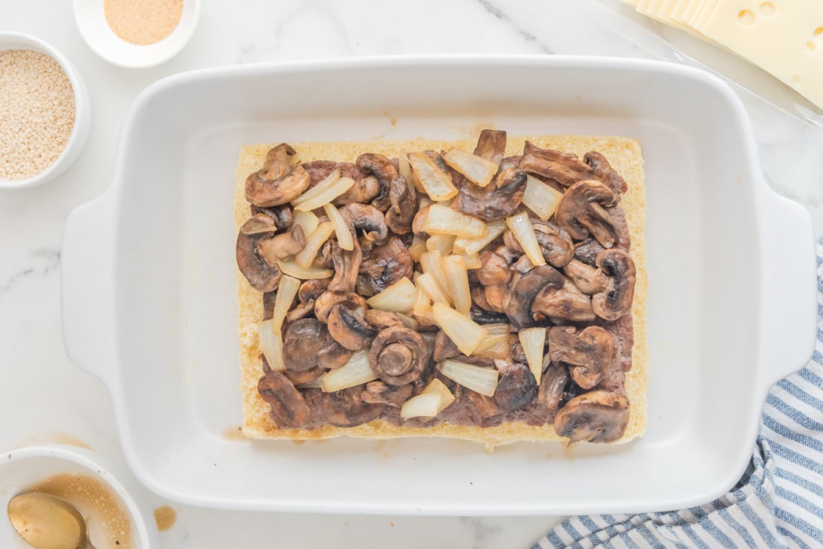 Add mushrooms and onions to top of patties