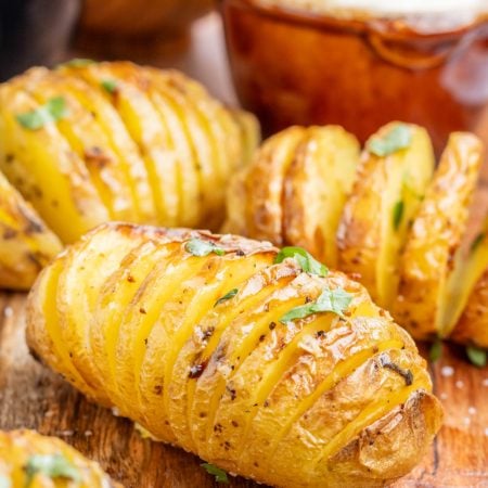 Air Fryer Garlic Butter Hasselback Potatoes on a cutting board