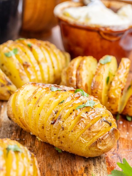 Air Fryer Garlic Butter Hasselback Potatoes on a cutting board