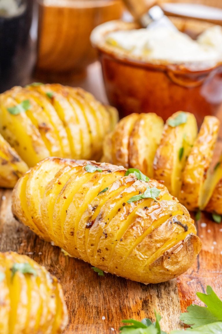 Air Fryer Garlic Butter Hasselback Potatoes on a cutting board