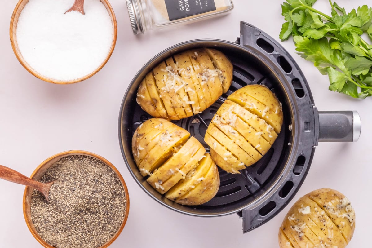 Air Fryer Garlic Buttered Hasselback Potatoes in an Air Fryer Basket