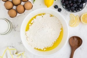 melted butter, sugar, lemon extract, and lemon zest and flour in a bowl