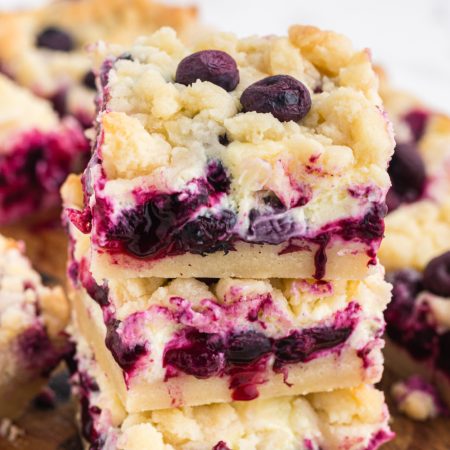 Blueberry Lemon Pie Bars stacked on top of each other