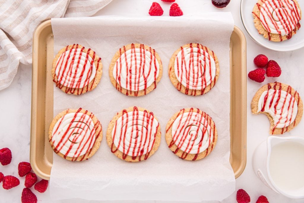 Copycat Crushed Raspberry Cheesecake Cookies on a baking sheet